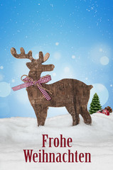Elch in Schneelandschaft mit Frohe Weihnachten