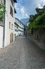 Fototapeta na wymiar picturesque street in an old alpine village in the Swiss Alps
