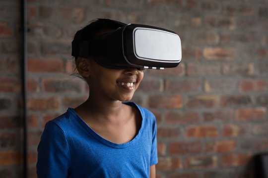 Girl using virtual reality headset in office