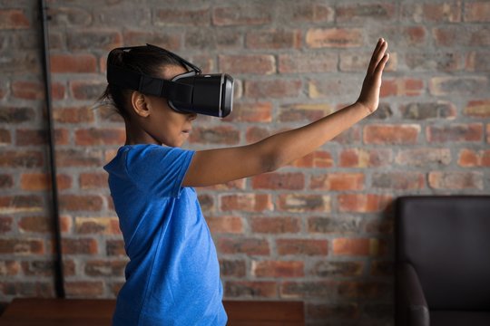 Girl using virtual reality headset in office
