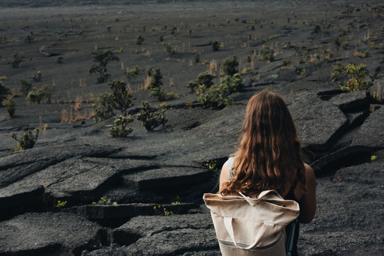 Woman on volcanic rock