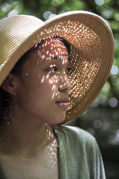 Woman in woven hat