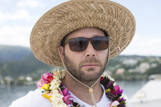 Man in sunglasses and hat on vacation