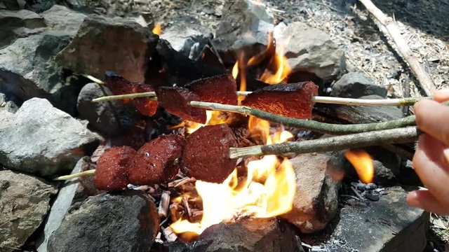 Turkish Sausage (sausage) cooking on fire. 