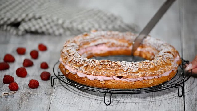 Homemade choux pastry cake Paris Brest with raspberries. French dessert.