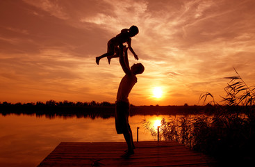 Family sunset on the lake