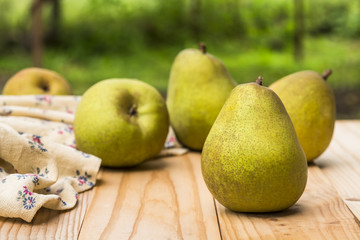 Organic  pears on a rustic wooden table
