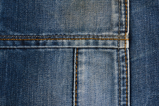 Neat stitching on the pocket of blue denim jeans