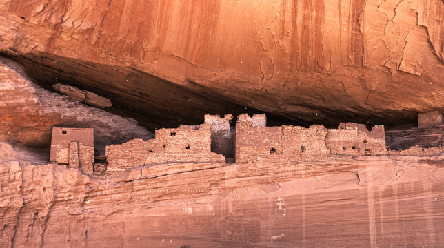 Historic native anasazi cave dwellings built in a sandstone cliff in the Canyon de Chelly, Chinle, Arizona, USA.