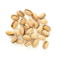 Salted pistachios isolated on white background. Top view.