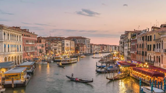Venice city skyline day to night sunset timelapse from Rialto Bridge and Venice Grand Canal, Venice, Italy 4K Time lapse