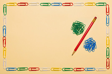 A percent sign from a pencil and paper clips.