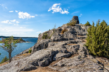 Fototapeta premium An old navigation mark, called Kupa Klint, in the form of a cairn on an Island in st. Anna archipelago, Baltic Sea
