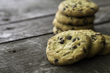 Chocolate cookies on natural wooden table.