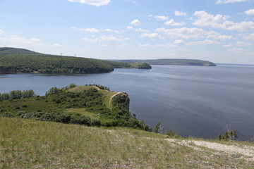 Zakharov Festival, Russia, Molodetsky Kurgan, Zhigulevskoe Sea, on the bank of the Volga River. Landscape of the rock, hilly terrain with people.