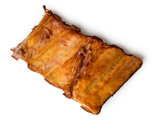 Smoked pork wings on a white. The view from the top.