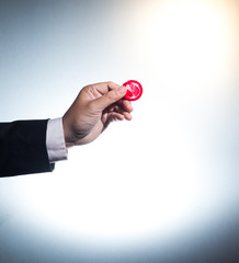 Business man gives a condom.