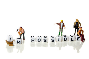 Removing white cubes with letters i and m of the word impossible creating new word possible on...