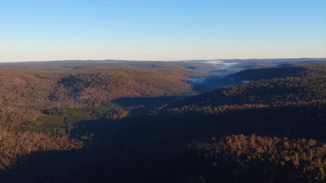 Fresh winter morning in the Western Australian bush overlooking a valley filled with fog.