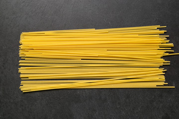 A pack of spaghetti on a slate plate