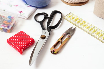 Sewing and crafts tools - scissors, measuring tape, pins, rope, cutter, ruler...