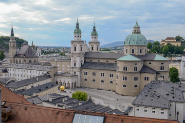 Fototapeta na wymiar View on Kapitelplatz, St Peter's Abbey, Franciscan Church and Salzburg Cathedral, Austria