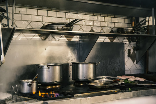 fish on plate and stove running full steam