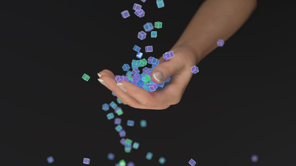 colored cubes fall into the hand