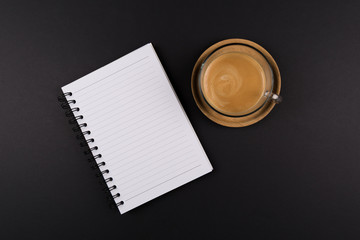 Notebook, Cup of coffee on a Wooden tray, on black table, shot from above, with place for your text
