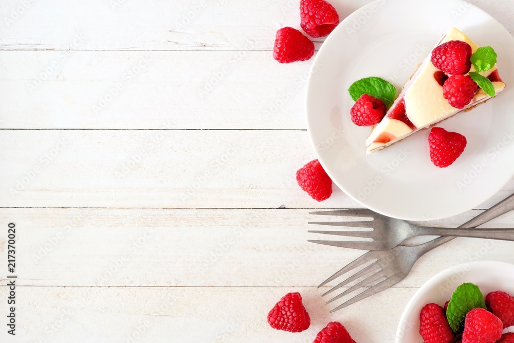 Poster slice of raspberry cheesecake, top view on a white wood background. side border with copy space.