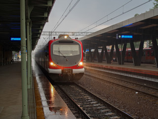 Rainy day modern train waiting station for passengers