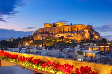 Rolgordijnen Aerial view of the Acropolis Hill, crowned with Parthenon during evening blue hour in Athens, Greece © Kavalenkava