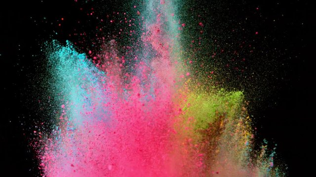 Super slowmotion shot of color powder explosions isolated on black background. Shot with high speed cinema camera at 1000fps