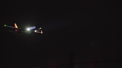 Southwest passenger plane flying in for a landing at night