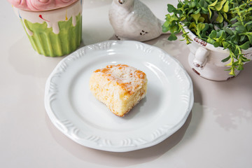 Mini whit cake - With plate and white background on a decorated table