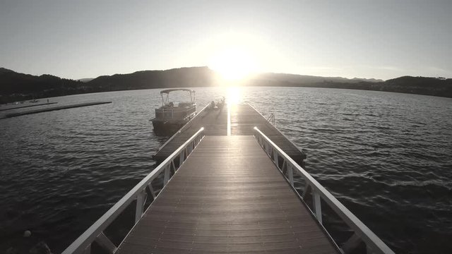 SUNSET IN THE LAKE WITH PEOPLE AND SHIP