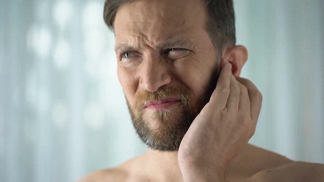 Sick guy feeling ear pain, health care, neurological infection, itchiness otitis