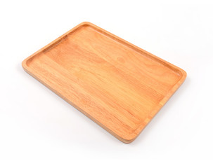 Brown wooden cutting board on white background