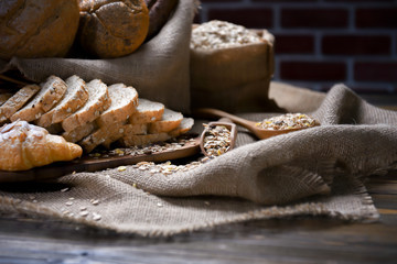 Close up, Tasty croissants on wooden table, hemp sack, area for wording