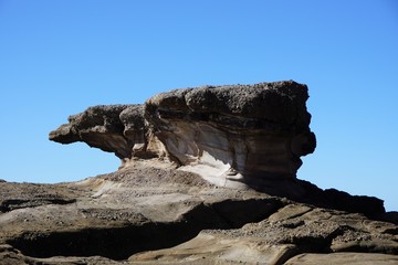 Fototapeta na wymiar Close Up of Wave-Shaped Rock at Caves Beach, NSW Central Coast, Australia