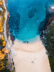 Top down aerial view of small beach.