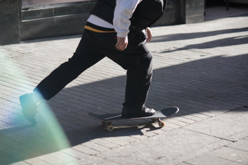 Skateboarder with lens flare