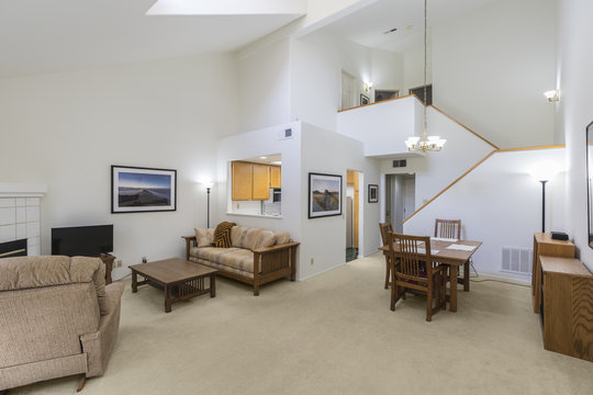 High Ceiling Condo Living Room.  Framed Wall Art Is The Photographers Work And Is Included In The Release.  