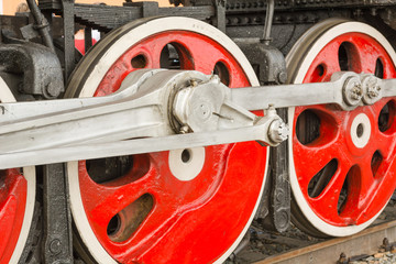 Wheels close-up on a locomotive. Large wheels.