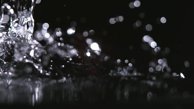 Super slow-motion shot of pouring water against black. Shooted with high speed cinema camera at 1000fps