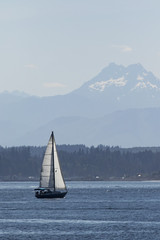 Sailing in the puget sound with the olympic mountains behind