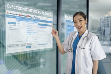 Electronic medical record system show on transparent display on glass windows.