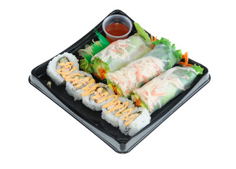  close up on fresh spring roll and sushi on black tray