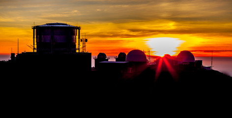 sunset behind observatory