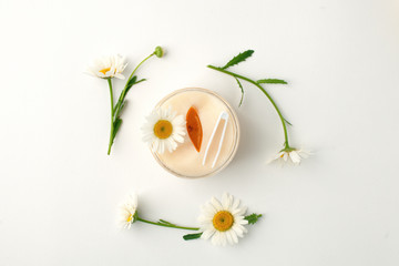 Plant-based beauty products. Eyes pads with herbal extract, camomile flowers, concept of organic plant cosmetics product.